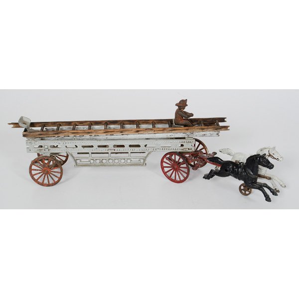 Cast Iron Horse-Drawn Fire Ladder Wagon : Cast Iron Horse-Drawn Fire Ladder Wagon Toy fire ladder wagon pulled by two horses. With iron driver and one original ladder; lg. 23.5 in