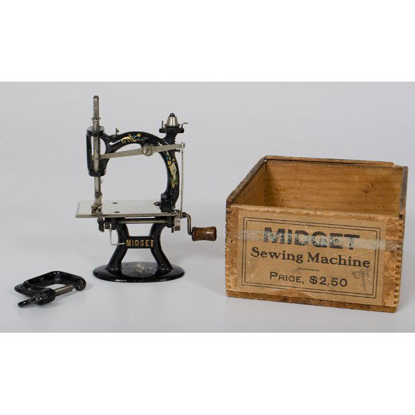 Foley & Williams Child's Sewing Machine : Foley & Williams Child's Sewing Machine Chicago, Illinois, early 20th century. A child's Midget sewing machine manufactured by Foley & Williams in the original wooden box with label reading Midget /