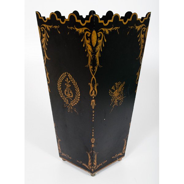 Tole Waste Basket : Tole Waste Basket 20th century. A tole waste basket with black ground and gold painted florals and musical instruments, having a scalloped rim and ball feet; ht. 20, wd. 10, dp. 10 in.