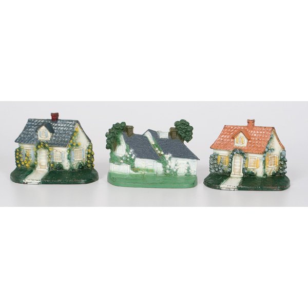 Hubley Cast Iron Cottages Doorstops : Hubley Cast Iron Cottages Doorstops American, three cast iron and painted doorstops of Cape Cod Cottages, made by Hubley; largest ht. 6, wd. 7.5 in.