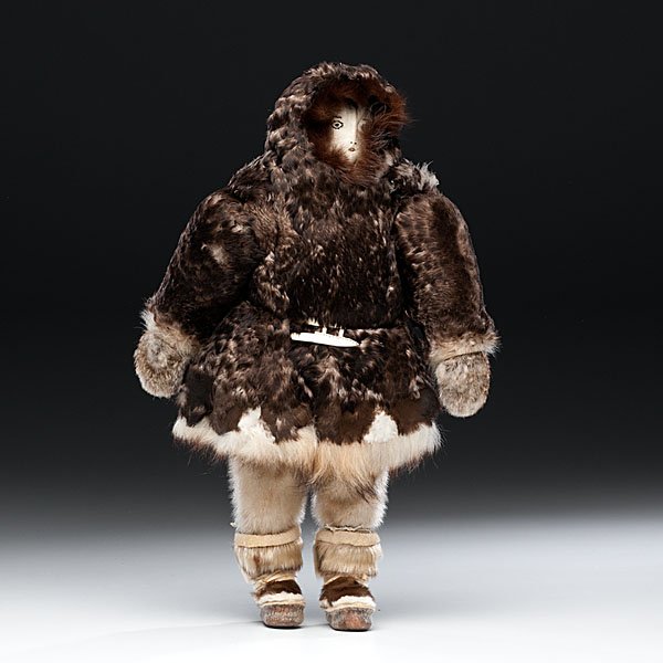Eskimo Doll : Eskimo Doll plump doll cozied in feather parka and seal fur leggings; embroidered leather face, height 17 in. second quarter 20th century