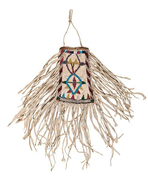 Apache Beaded Hide Mirror Bag : Apache Beaded Hide Mirror Bag thread-sewn on softly tanned hide and beaded using a variety of colors of larger glass beads; fringe frames edges of bag, total length 12 in. late 19th century