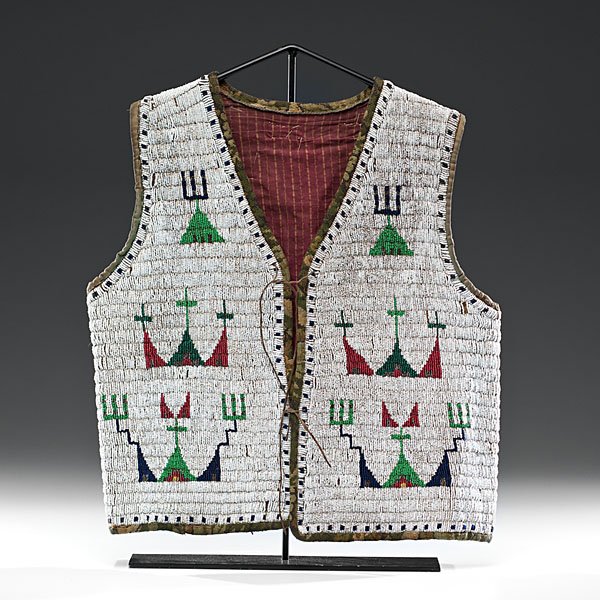 Sioux Beaded Hide Vest : Sioux Beaded Hide Vest thread and sinew-sewn using bead colors of pea green, red white-heart, dark blue, bottle green, greasy yellow, and marcasite; edged with heavy green fabric and lined with stri