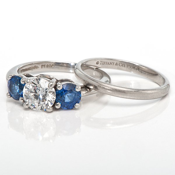 Tiffany & Co. Platinum Three-Stone Ring with Band : Tiffany & Co. Platinum Three-Stone Ring with Band Ladies PT950 (platinum) three-stone ring with a VS2, F color center diamond measuring 6.4 mm x 6.375 mm x 3.875 mm and weighing approximately one ca