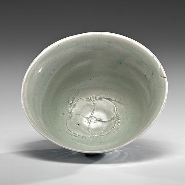 Bernard Leach (1887-1979; Hong Kong/UK) : Faceted Bowl with Carved Flower Interior ca 1970 Porcelain: ht. 3.5 in. x dia. 7.75 in.; artist stamp on side of foot Leach was particularly effective with porcelain. This ceramic body’s tight and