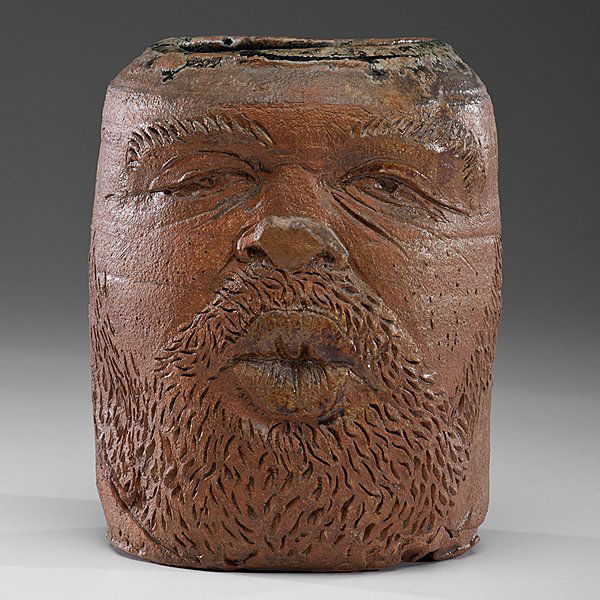 Robert Arneson (1930-1992; USA) : Pot Kisser 1978 Stoneware, ht. 8.5 in. x dia. 6.75 in.; incised signature on foot; acquired from Garth Clark Gallery, NY. This work is a portrait of the artist kissing a pot while being a pot. Arne