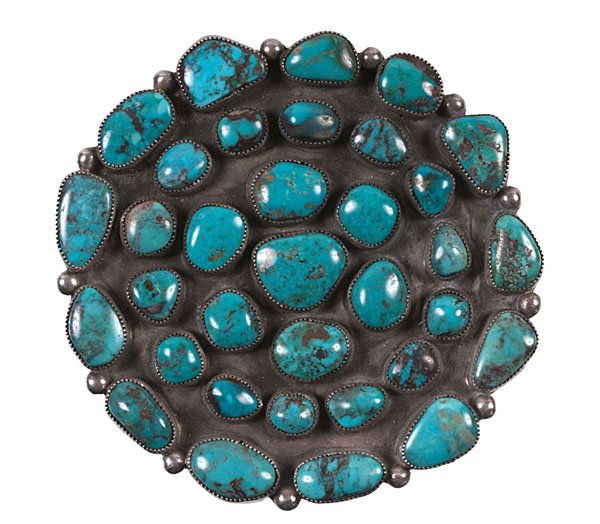 Navajo Turquoise Cluster Pin/Pendant: with traditional image. Pin set with 34 baroque stones, diameter 3.5 in. second quarter 20th century Dr. Kent Vickery (1942 - 2011) grew up with parents who were avid collectors of Native Americ