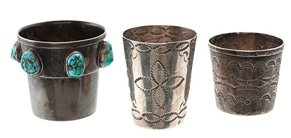 Decorated Silver Shotglasses : lot of 3, including one unmarked piece with stamped decorations, height 1.5 in. x diameter1.25 in.; PLUS another Mexican stamped shotglass marked La Aztexa/ Zilver/ Mexico/ Sterling, height 2 in. x d