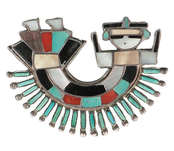 Zuni Channel Inlaid Pin/ Pendant of Rainbow God : with delicate detail comprised of shell, turquoise, and jet accented with turquoise needlepoint creating rays over the rainbow, width 2.25 in. ca 1960