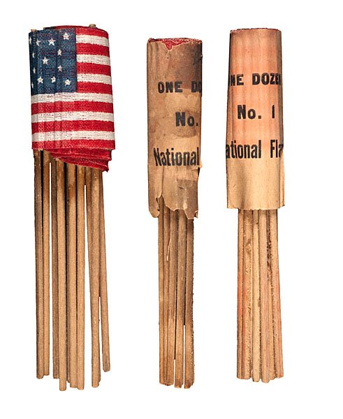 Packs of 13-Star Wreath Parade Flags on Sticks : Packs of 13-Star Wreath Parade Flags on Sticks 3 packs of 13-star wreath parade flags attached to sticks, consisting of 12 flags per pack. Starched gauze, 3 x 2 in. 1876. Most likely made for the 