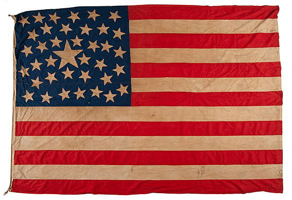 38-Star American Flag : 38-Star American Flag Cotton, approx. 72 x 100 in., machine-sewn flag with one large central star surrounded by 37 scattered stars. Stars are set into cut-outs in canton. Cotton sleeve hoist with j