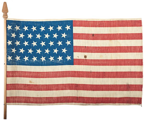 38-Star National Parade Flag : 38-Star National Parade Flag Cotton, 22.5 x 14 in., printed national parade flag with 38 stars in a scarce 8/7/8/7/8 pattern, which gives the canton a longer, narrower appearance. Attached to stick