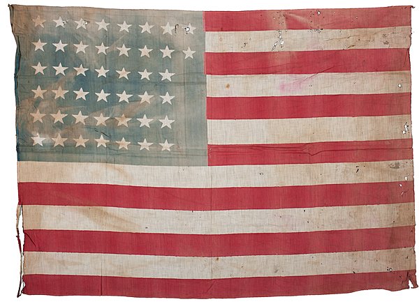 44-Star Printed National Parade Flag : 44-Star Printed National Parade Flag Cotton, 41.5 x 29.5 in., printed national parade flag with 44 stars configured in 8/8/7/7/7/7 pattern, which is very rare. 1891-1896. Provenance: Thomas D. Sc