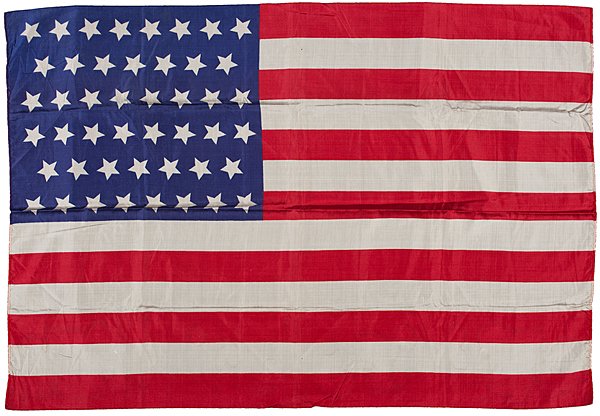 46-Star Printed National Parade Flag : 46-Star Printed National Parade Flag Silk, 35 x 23.5 in., printed national parade flag with 46 stars arranged in tumbling star pattern. 1908-1912. Strong, brilliant color. Provenance: Thomas D. Sc