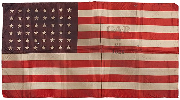 GAR, Scarce Overprinted 48-Star National Parade Flag : GAR, Scarce Overprinted 48-Star National Parade Flag Silk, 34 x 18 in., printed national parade flag with 48 stars arranged in 8/8/8/8/8/8 rows. Machine-stitched, hemmed edges. 1922. Overprinted: G.