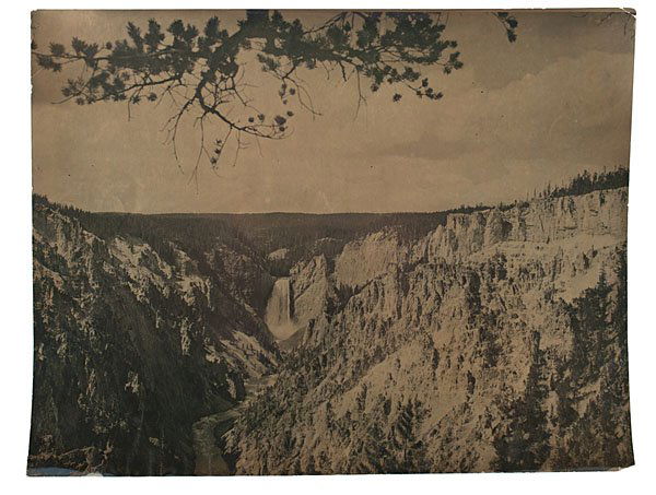 C.J.Belden, Gold-Toned Photo, Lower Falls, Yellowstone: Charles J. Belden, Gold-Toned Photograph of the Lower Falls of the Yellowstone Gold-toned, silver gelatin photograph, unmarked, but by Charles Belden, capturing a rugged, canyon landscape with a wat