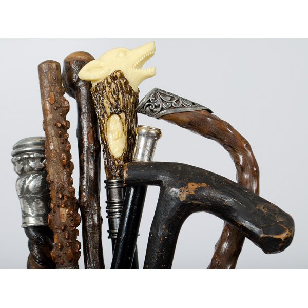 Carved and Metal Mounted Walking Sticks : Collection of seven canes, including two with natural branch design, two with silver metal handle accents, one rough branch cane with silver metal collar, ebonized wood shaft cane with engraved silver
