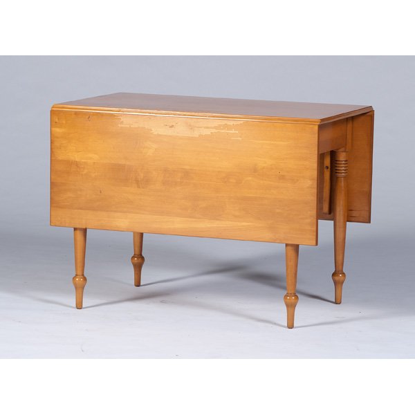 Maple Drop-Leaf Table : American, 20th century. A drop-leaf maple table, having a single board top and leaves, supported by simple turned legs, retains partial paper label to underside for Rike Kumler Co. Dayton, Ohio; ht. 2