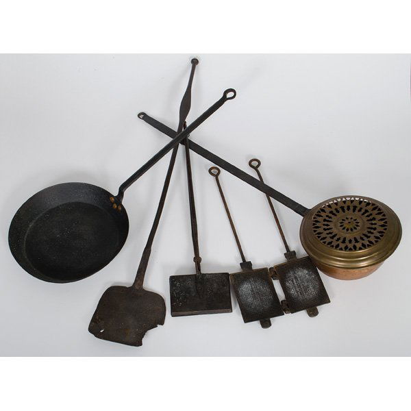 Wrought Iron and Copper Cooking Utensils : An assembled group of five wrought iron and copper cooking and kitchen utensils, including a copper warming pan with cast iron handle and pierced lid, a wrought iron pan, two cast iron wafer presses a