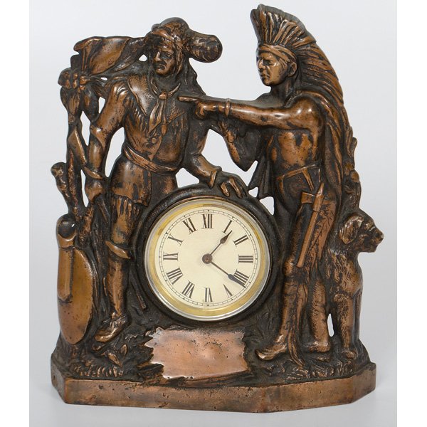 Regent Fur Trader and Indian Cast Iron Clock : American, ca 1910-1920. An iron front shelf clock with 30 hour movement, the case in the form of figures of a fur trader and an Indian, marked Regent Mfg. Co., Chicago on case; ht. 13.25 in.