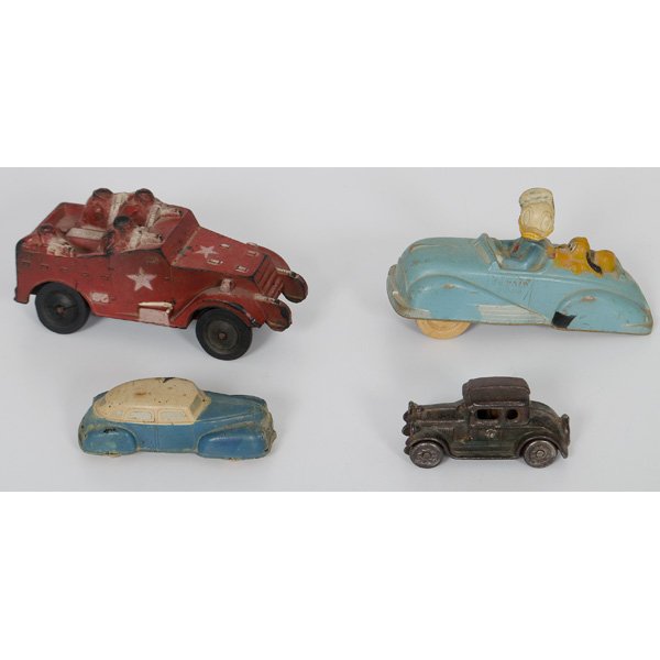 Sun Rubber Toy Cars Including Donald Duck, Plus : American, 20th century. Molded rubber toy cars, one featuring Donald Duck and Pluto, one featuring four soldiers with guns, and a smaller sedan, all marked for Sun Rubber Company, PLUS a metal sedan; 