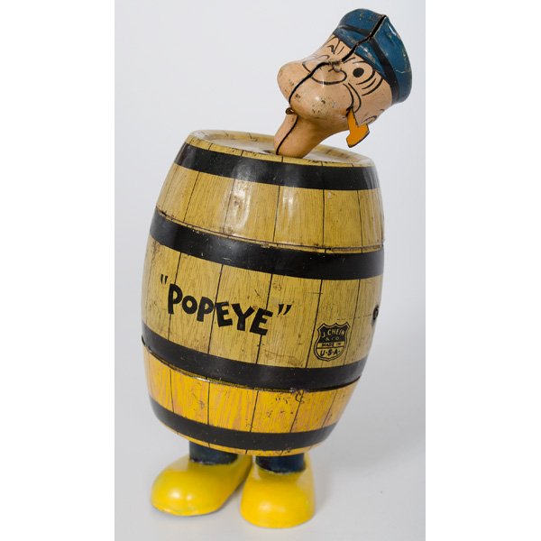 Walking Popeye in Barrel Wind-Up Toy : A 1932 King Features Syndicate walking Popeye in a barrel wind-up toy, lithographed tin, key wind operated, ht. 7 in.