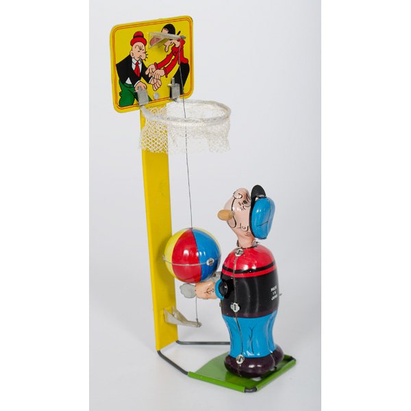 Basketball Popeye Wind-Up Toy : A Popeye playing basketball, lithographed tin wind-up toy, made in Japan; ht. 9 in.