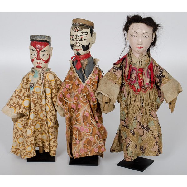 Taiwanese Opera Puppets on Stands : Taiwanese, mid 20th century. Group of three carved and painted wood opera puppets, including two with dramatically painted faces, one female with hair wig, all attired costumes, possibly original; ht.