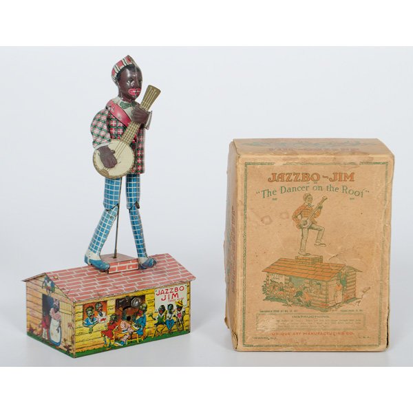 Jazzbo Jim Jigger with Original Box : American, 20th century. Black Americana lithographed tin wind up "Jazzbo Jim" toy by Unique Art Mfg. Co. of Newark, N.J. Figure dances and strums banjo when mechanism wound, and is accompanied by ori