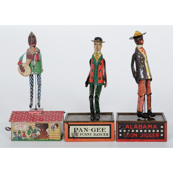Lithographed Tin Wind Up Dancing Toys : American, early 20th century. Three lithographed tin wind up toys, including "Jazzbo Jim" who strums a banjo on a rooftop and "Alabama Coon Jigger", both by Ferdinand Strauss, and "Pan-Gee the Funny