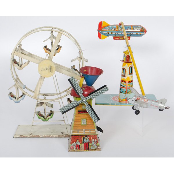 Tin Toy Ferris Wheel, Sky Rangers and Mill : 20th century. Three lithographed tin toys, including German cream painted clockwork ferris wheel with lithographed riders, a "Mac Dutch Mill," and a Unique Arts Mfg. Co. "Sky Rangers" wind up propelle