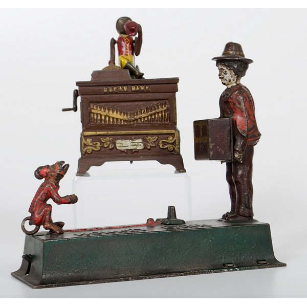 Cast Iron Organ Grinder and Monkey Banks : American. Two mechanical cast iron banks, including an Organ Bank with Pat. May 31. 1881 on back and a Monkey Bank; Monkey Bank lg. 8.75 in. Provenance: Estate of Jan Sorgenfrei