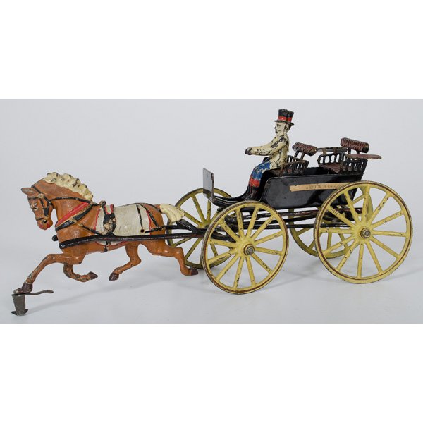 Pratt & Letchworth Cast Iron Surrey : American, late 19th century. Cast iron horse drawn surrey with two seats and driver. Toy has unusual paper labels along side walls, possibly bearing the name of its young owner Arthur H. Eggleston; lg