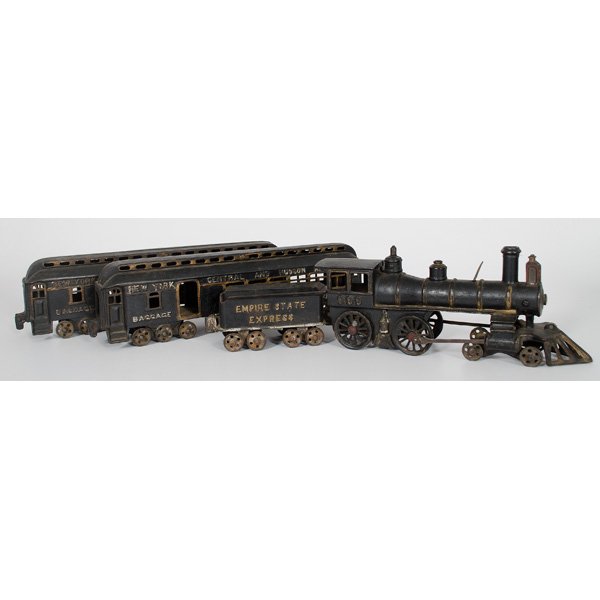 Kenton Empire State Express Train : American, late 19th-early 20th century. Cast iron floor train by Kenton, including locomotive, Empire State Express tender as well as two Central and Hudson River passenger cars, all with some remaini