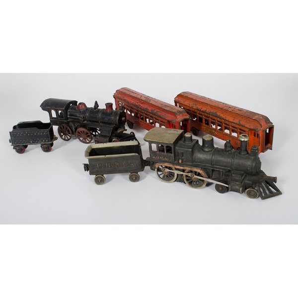 Hubley Cast Iron Train Set, Plus : American, 20th century. Cast iron train set by Hubley, including locomotive, tender, and two passenger cars for the Pennsylvania Railroad Company. PLUS cast iron engine with damage and tender; passen