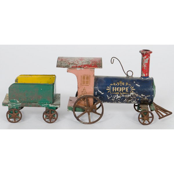 Early Painted Tin "Hope" Locomotive and Tender : American, late 19th century. Tin locomotive and tender with colorful painted design, including gilt stenciled "Hope" on both sides of engine barrel. Toy may be the work of Hill & Stafford; combined lg