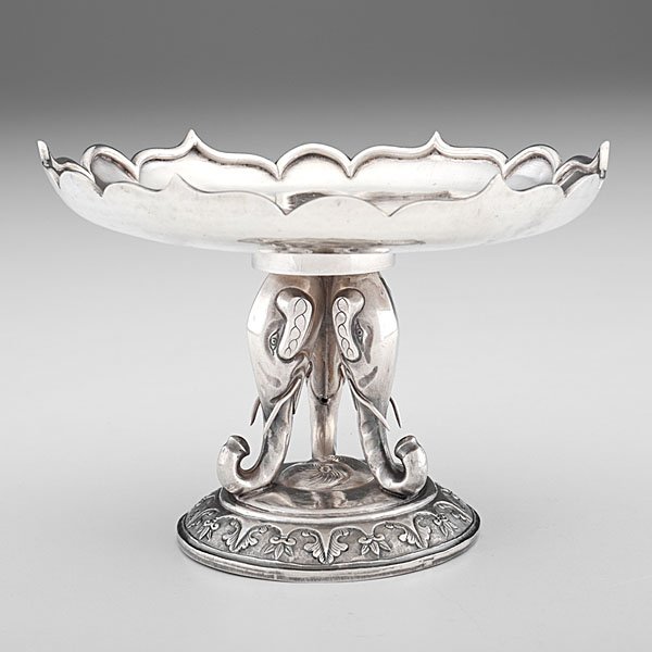 Chinese Export Silver Compote : Chinese, 20th century. Silver compote in two interlocking pieces, designed with ogee rim surrounding central field engraved with floral motif, rising on three elephant head supports and domed base. Ma