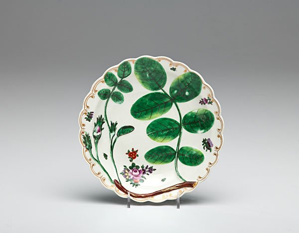 Early "Blind Earl" Pattern Worcester Plate : English, ca 1770. Worcester plate with the characteristic bas-relief molded "Blind Earl" pattern, accented by floral vignettes; dia. 7.5 in.