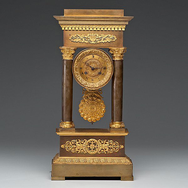 French Mantel Clock : French, 19th century. A gilt bronze mantel clock with decorative floral ormolu mounts and Corinthian columns; ht. 21 in. Provenance: Property of Dr. James Ward, Louisville, Kentucky