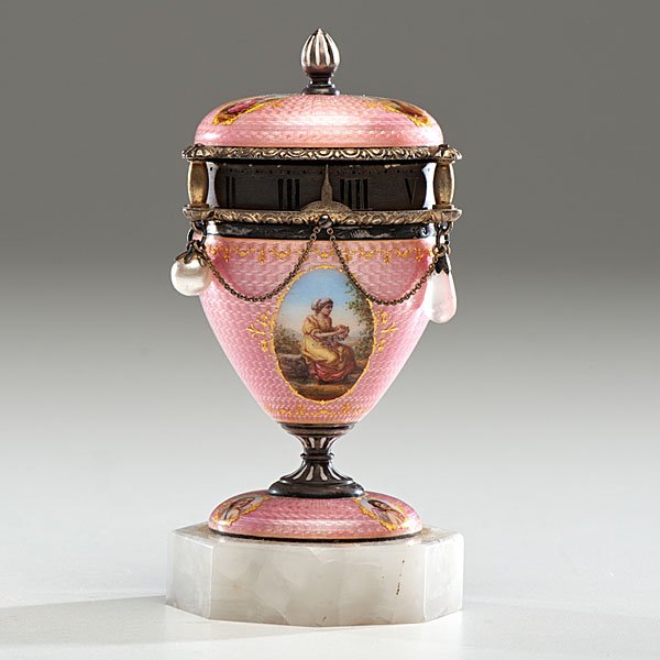 Continental Annular Dial Miniature Urn Clock : Continental, (Swiss or Austrian), ca 1900-1920. A pink enamel over silver miniature urn-shaped clock with annular dial and swag chains, having hand-painted female portrait reserves or cameos to top an