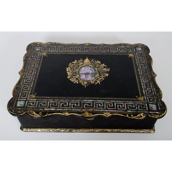 Papier Mache Writing Box : English, 19th century. A papier mache writing box with gilding and mother-of-pearl inlaid top, border and sides, the top lifting to reveal a fitted interior and velvet covered writing surface; ht. 3