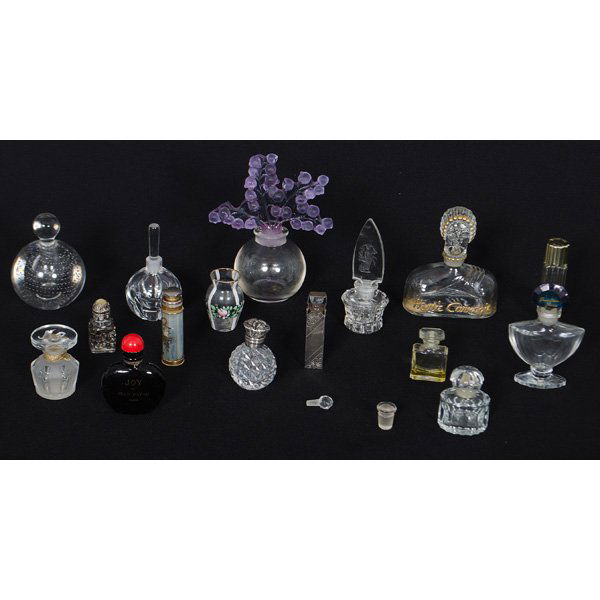 Lalique, Sterling Mounted, and Glass Perfume Bottles : A group of fifteen perfume bottles, including Lalique blue bellflower stopper and bottle created for the Lalique Society of America in 1991, a Hattie Carnegie gilt bust form bottle for "Carnegie II"