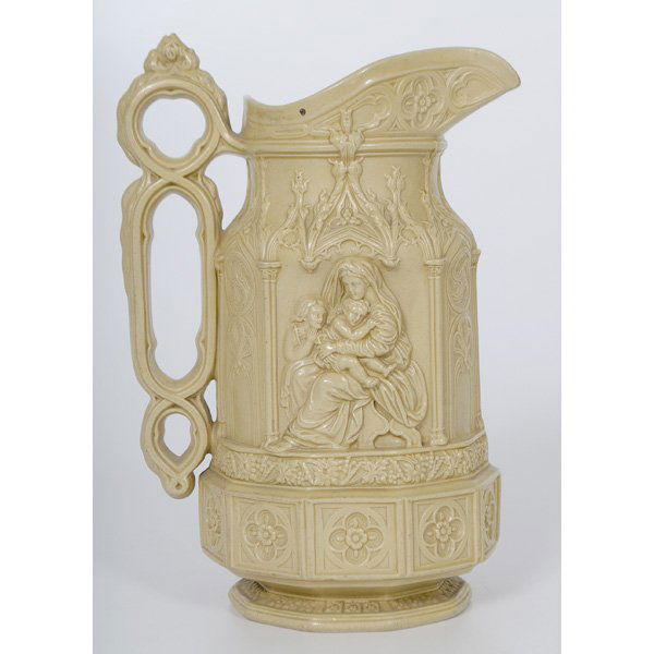 Charles Meigh Minister Jug : English, 19th century. A molded Charles Meigh minster jug in the Gothic revival style, with relief figures of Mary, Jesus and St. John the Baptist, with a white applied cartouche registry mark on bott