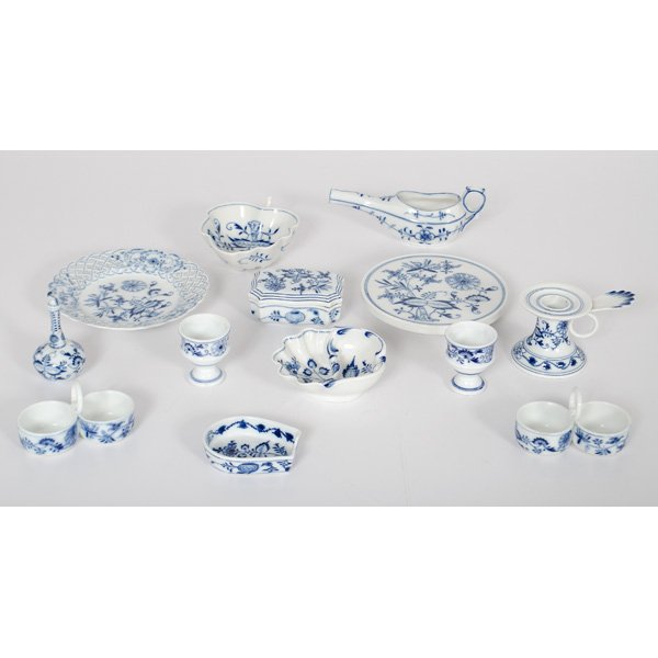 Meissen Blue Onion Porcelain Articles : German, 20th century. Ten pieces of Meissen porcelain, including chamber stick, box, perfume flagon, ashtray, spoon rest, trivet, two salt and peppers, a reticulated bread and butter plate, and a nut