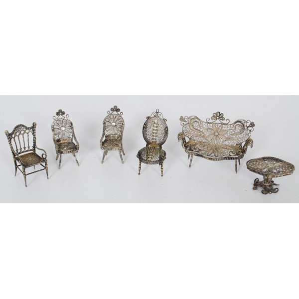 A Group of Victorian Miniature Silver Furniture : A group of Victorian miniature silver furniture including three armchairs, a sidechair, a side table and a settee; largest lg. 2.5 in.