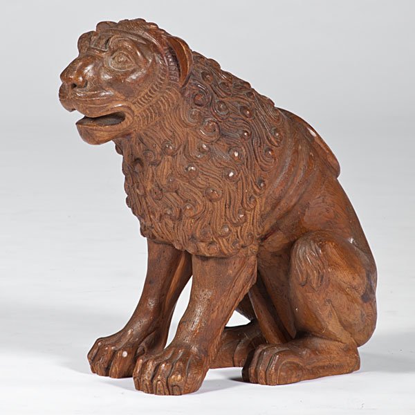 Large Carved Wooden Lion : Probably Taiwanese, 20th century. A large seated lion form, carved in a medieval style; ht. 22.5, wd. 13.5, dp. 24 in.