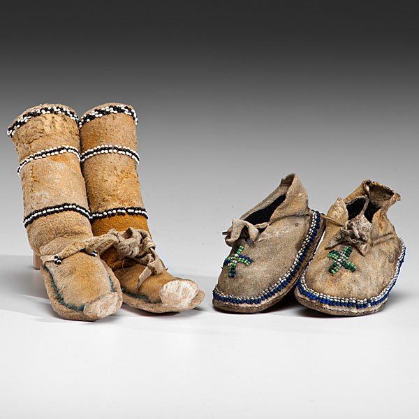 Cheyenne Infant and Apache Doll Beaded Hide Moccasins : lot of 2, including a pair of Cheyenne Infant moccasins sinew-sewn and beaded in dark blue, white, and light green; inked on soles M--(?) Lone Jr.; length 3.75 in.; AND a pair of Apache doll "cactus k