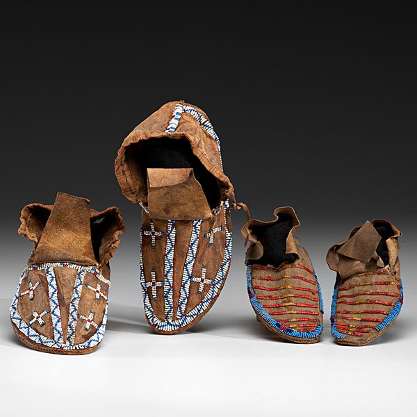 Sioux Beaded and Quilled Hide Moccasins : lot of 2, including a child's pair of beaded and quilled moccasins, sinew-sewn with a lane of medium and dark blue and red white-heart glass beads edging sole; vamp decorated with quilled bands, lengt