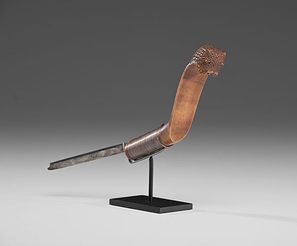 Micmac Figural Crooked Knife : chip-carved handle elegantly depicting a feline; steel blade inserted into wire-wrapped handle, total length 11 in. ca 1900