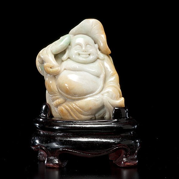 A Carved Chinese Jadeite Laughing Buddha with Stand : Chinese, 20th century. A carved jadeite laughing Buddha figure wearing a long flowing robe and carrying a sack, highly polished in a pale green color, with a wooden stand; ht. with stand 4.25 in.